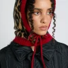 hood in leopard with red tie