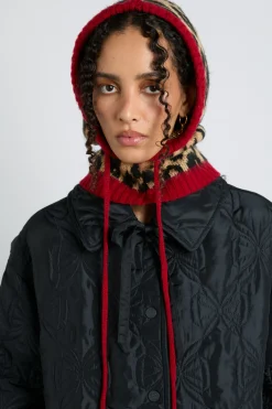 hood in leopard with red tie