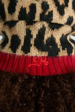 hood in leopard with red tie